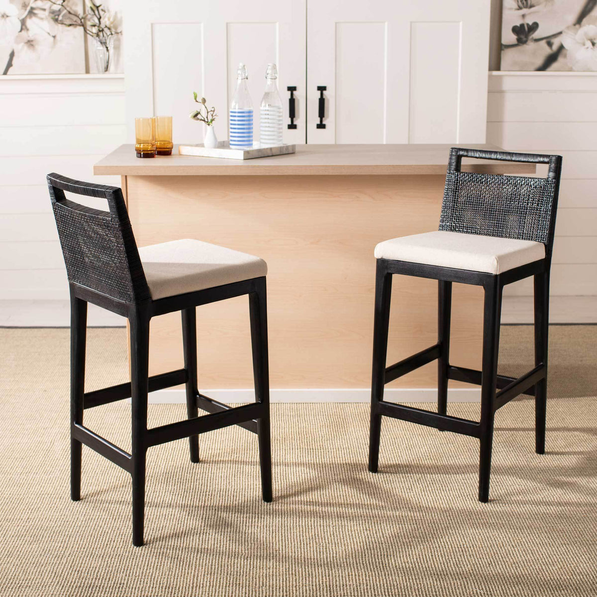 White-cushioned bar stools with woven backs offer welcoming seating at a light wood counter.
