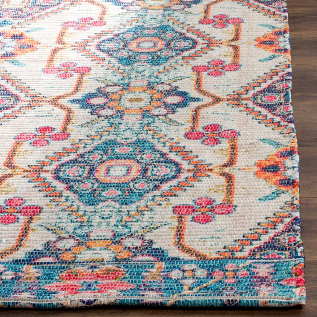 A textured cream weave features bright blue and coral motifs and a neatly finished rug edge