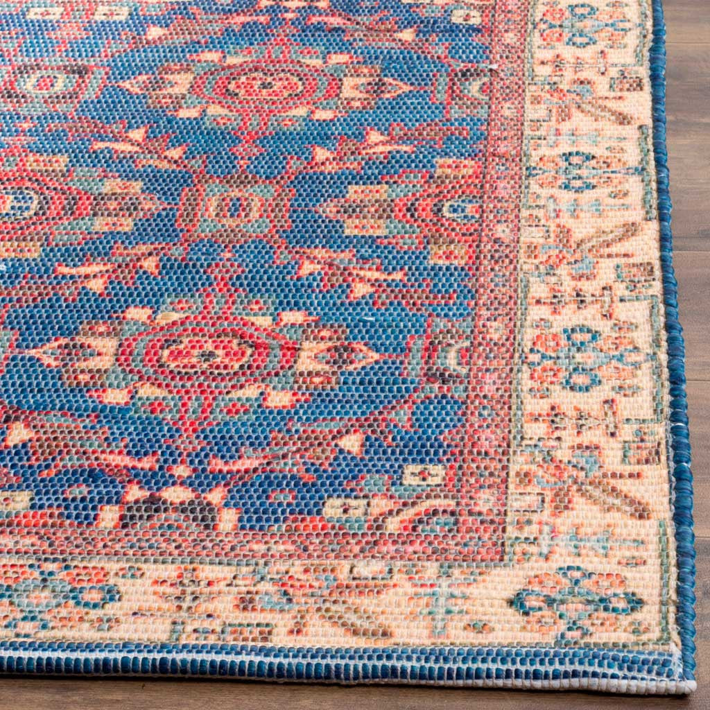 Coral and teal motifs meet a beige border finished with navy edge binding