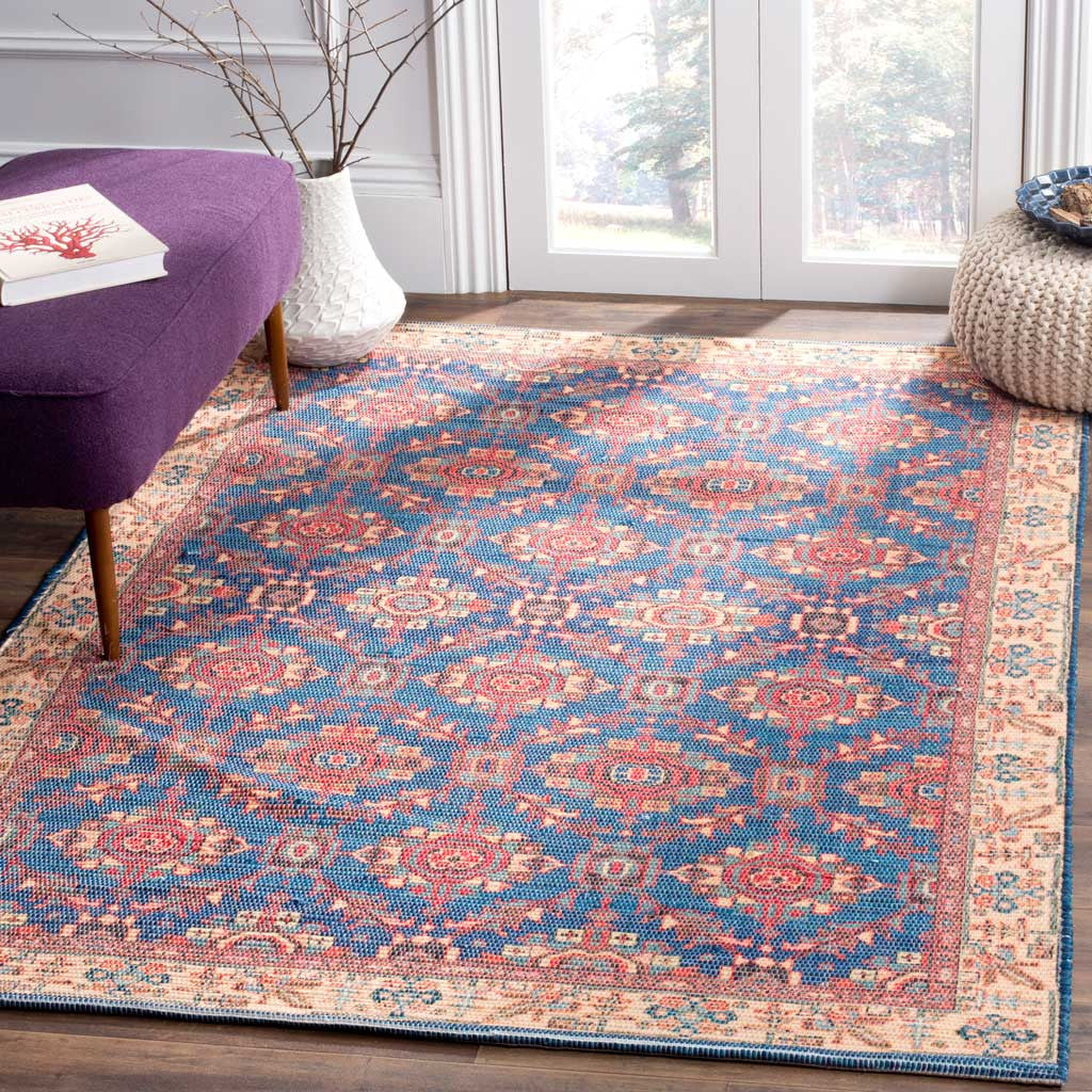 Navy and coral medallions bring vibrant color to a living area, framed by a beige border