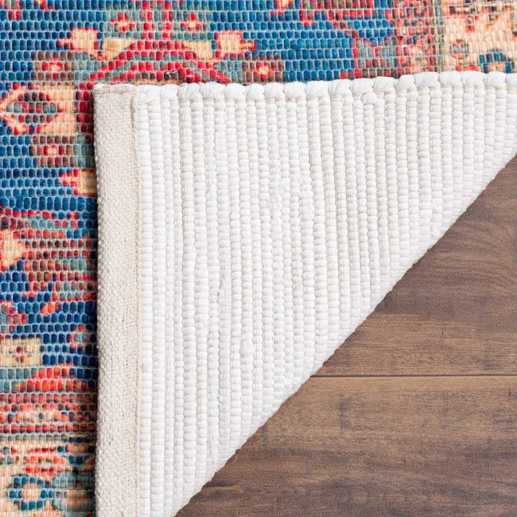 A folded edge reveals the rug's textured white woven backing
