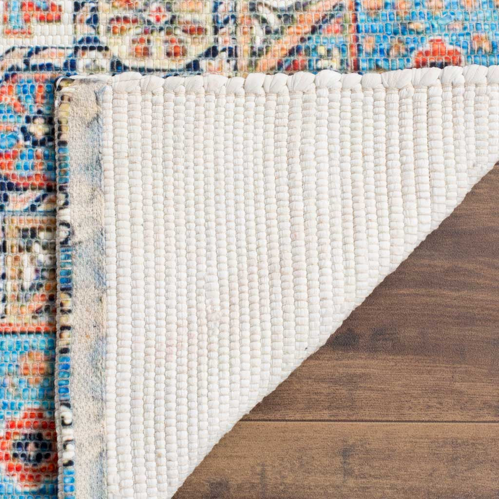 A woven white backing contrasts with the rug's colorful patterned face