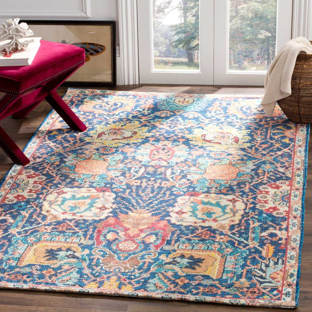 A blue and orange floral rug adds lively pattern to a wood-floored living space