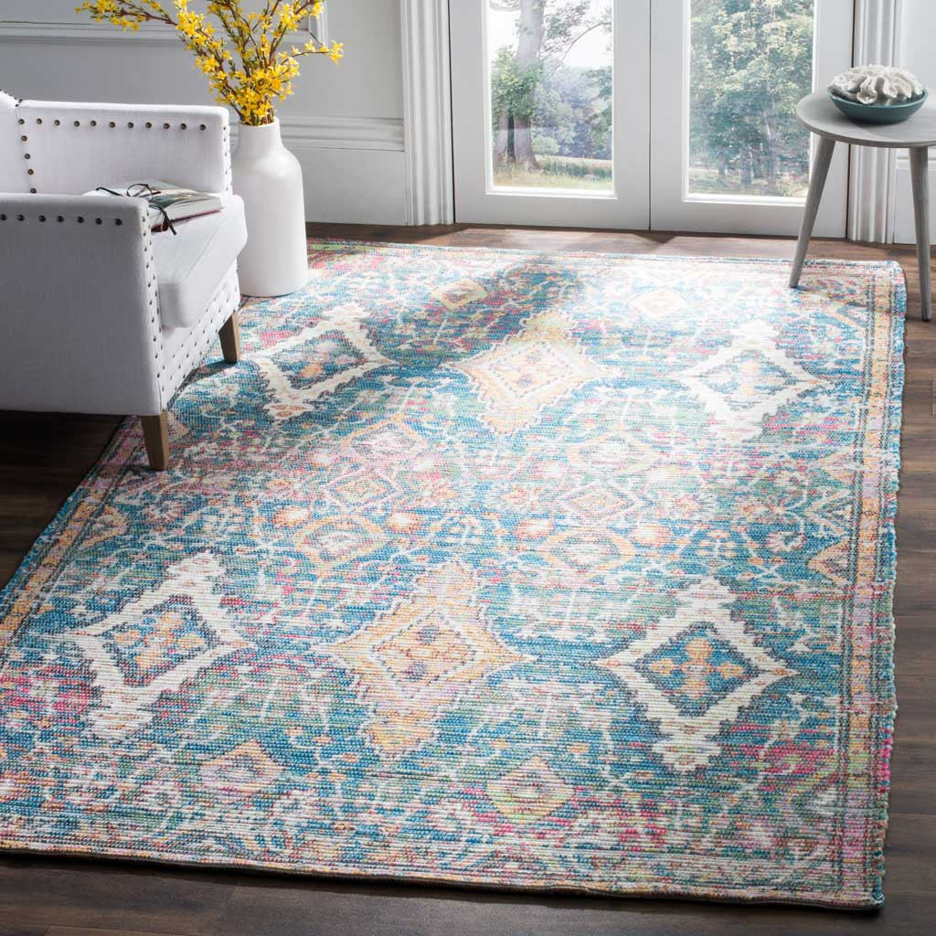 Turquoise and peach diamond motifs bring a lively, timeworn look to a bright living space