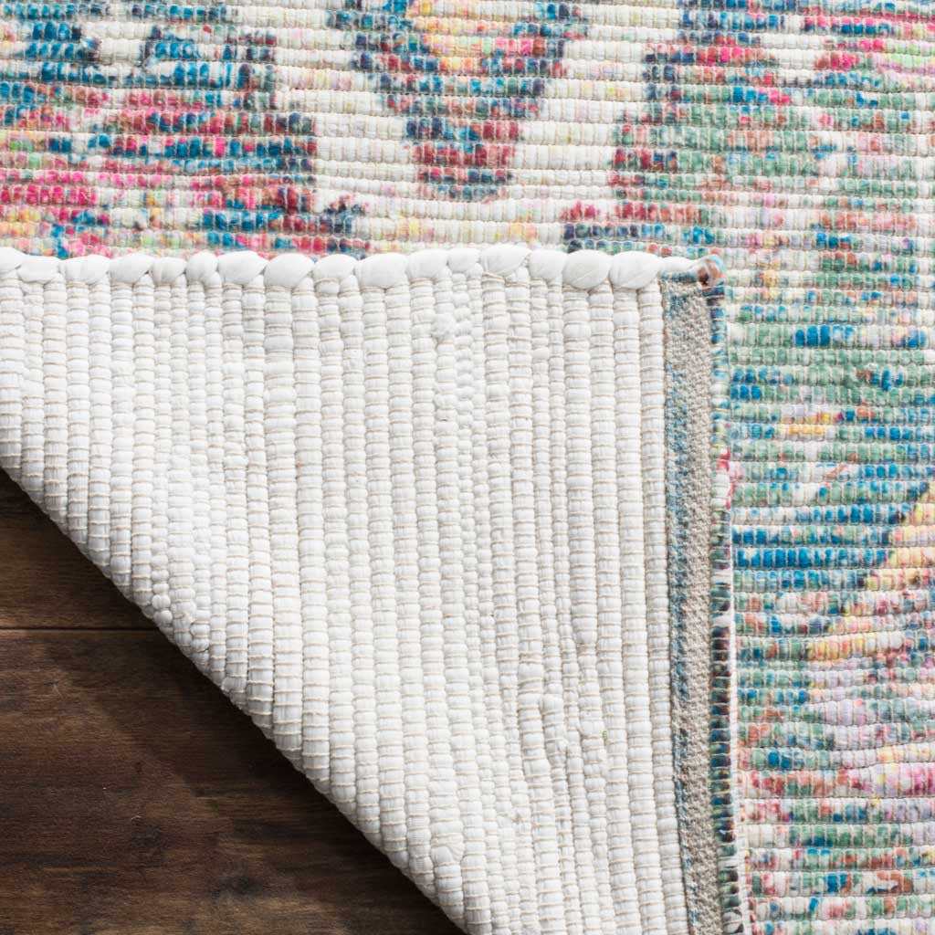 Pale woven backing complements the rug's colorful, textured surface and finished edges
