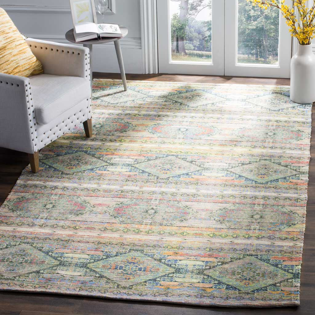 A colorful diamond-patterned rug adds inviting texture beneath an upholstered chair