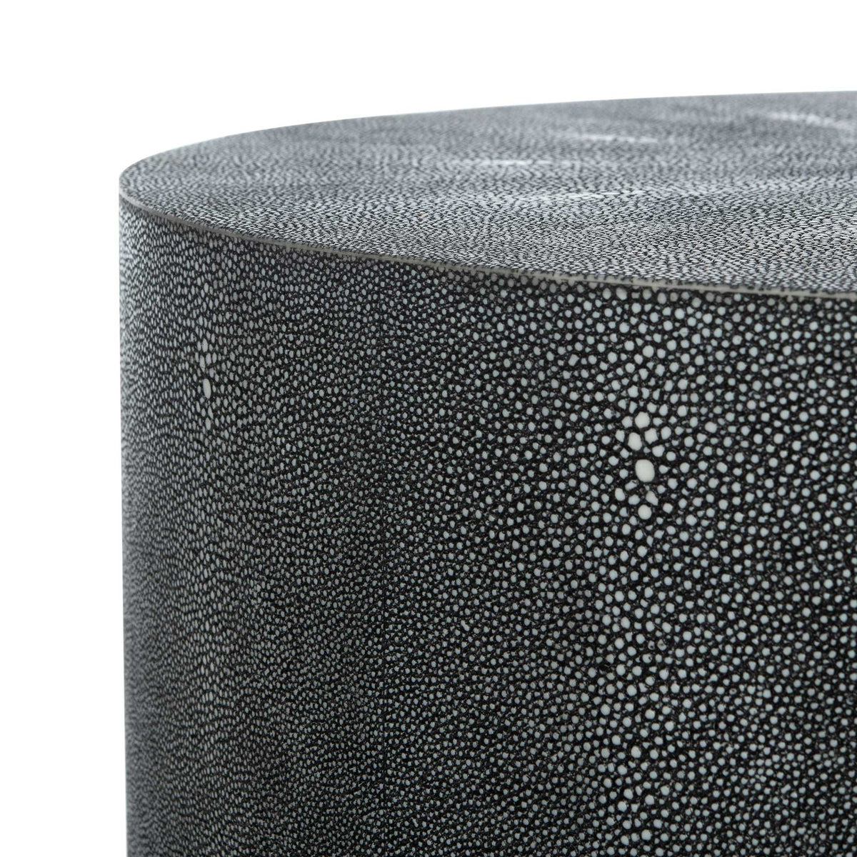 Curved tabletop edge and sides feature an intricate faux shagreen texture