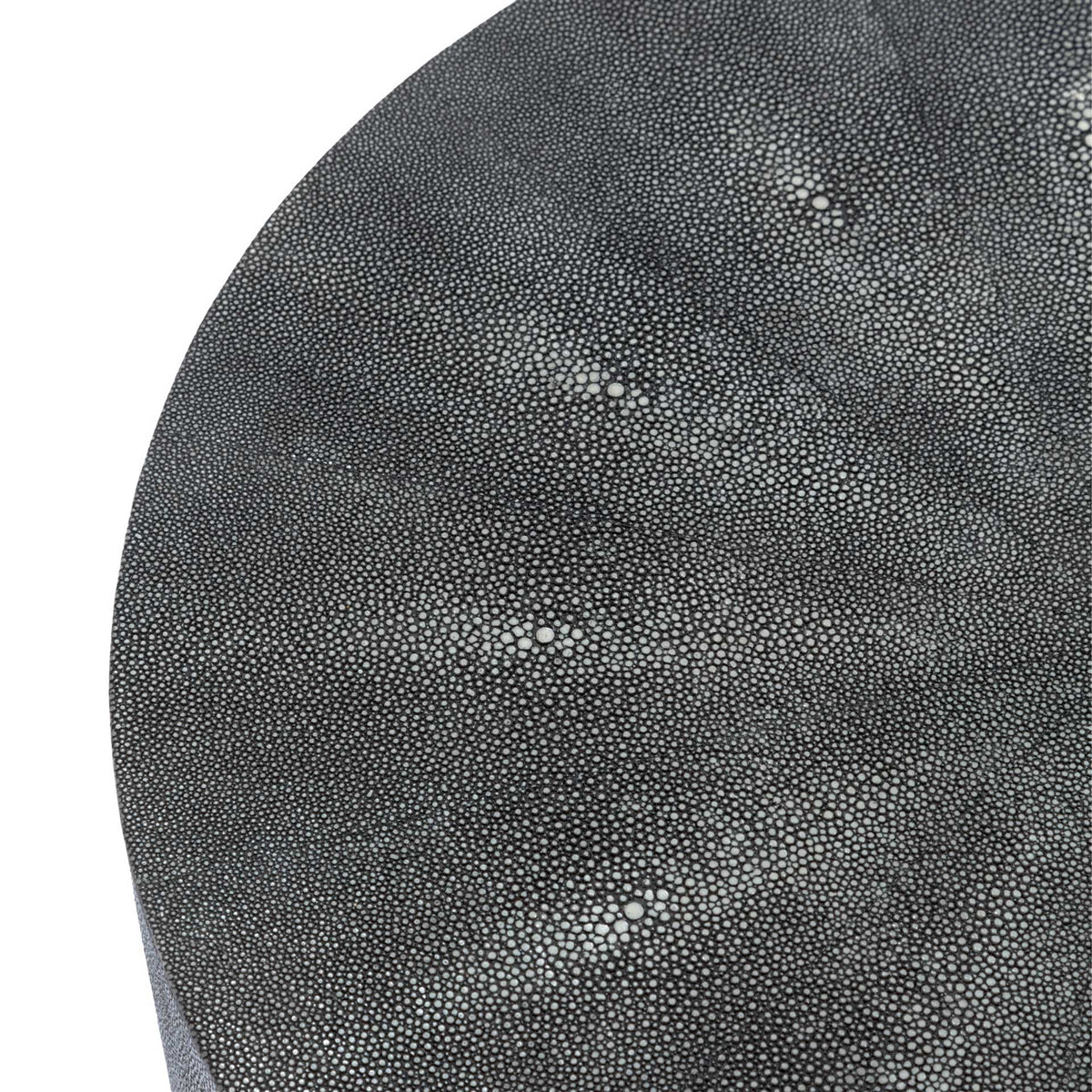 Subtle black and gray flecks bring depth to the table's patterned top