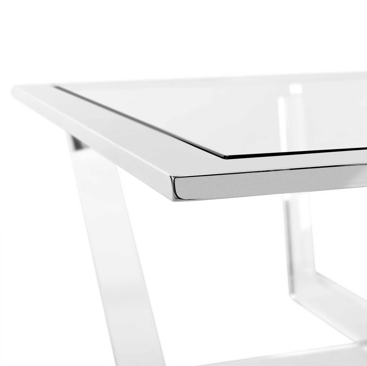 Polished metal trim frames the clear tabletop above an angular acrylic support
