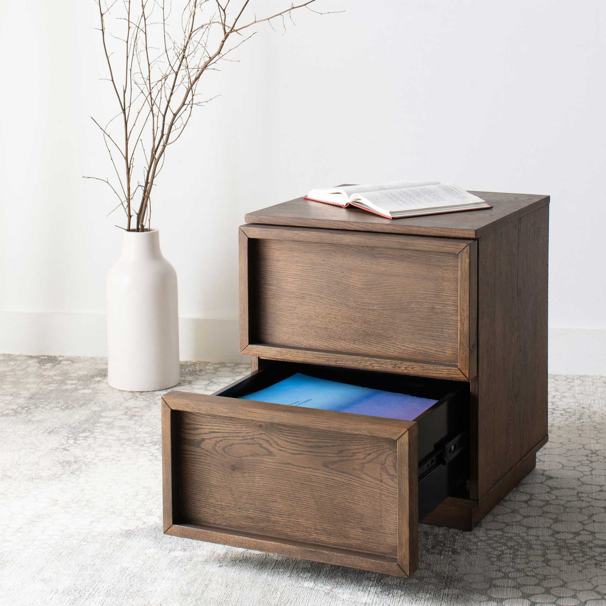 The lower drawer opens for easy access to storage beneath a framed upper drawer.