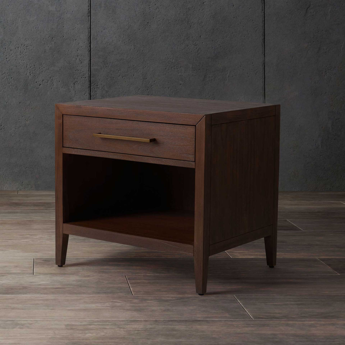 A warm brown finish, metal drawer pull, and open shelf balance style with bedside storage.