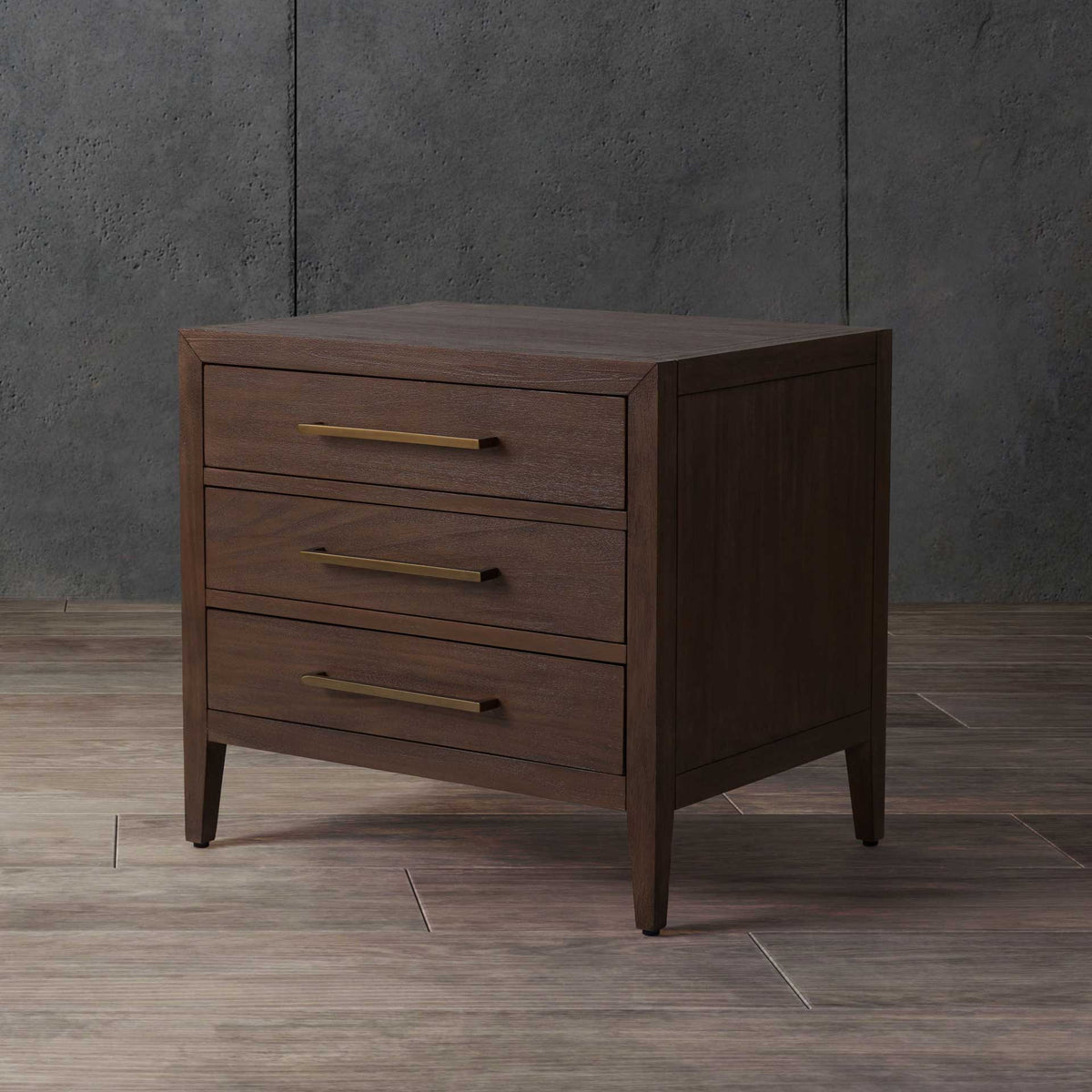 Warm brown wood and three brass-tone handles bring tailored storage to a cozy space.