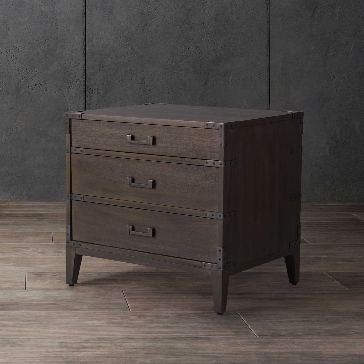 Light brown wood grain and dark metal details bring warmth and contrast to a three-drawer nightstand