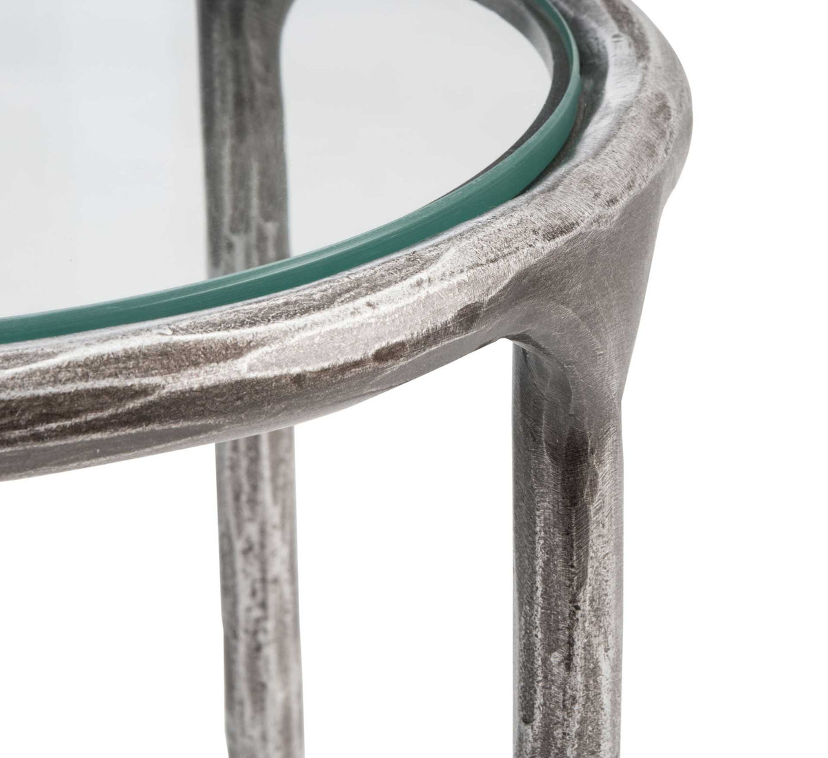 The glass top fits within a textured silver-toned rim that curves into a slim metal leg.
