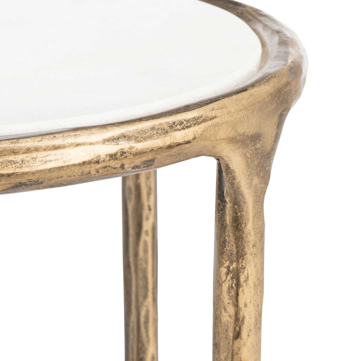 The smooth white marble top meets a textured brass-toned rim and a gently curved leg.