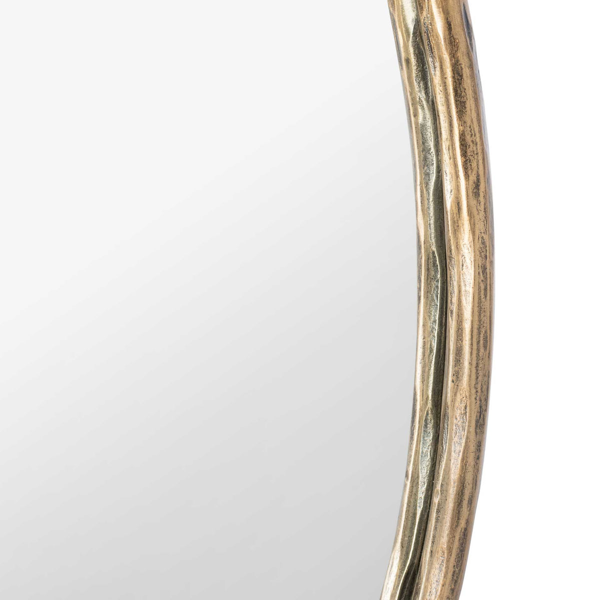 A rippled brass-finish metal rim adds texture along the mirror's edge