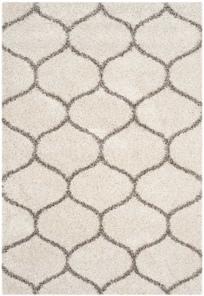 Gray contours create repeating rounded motifs across ivory shag