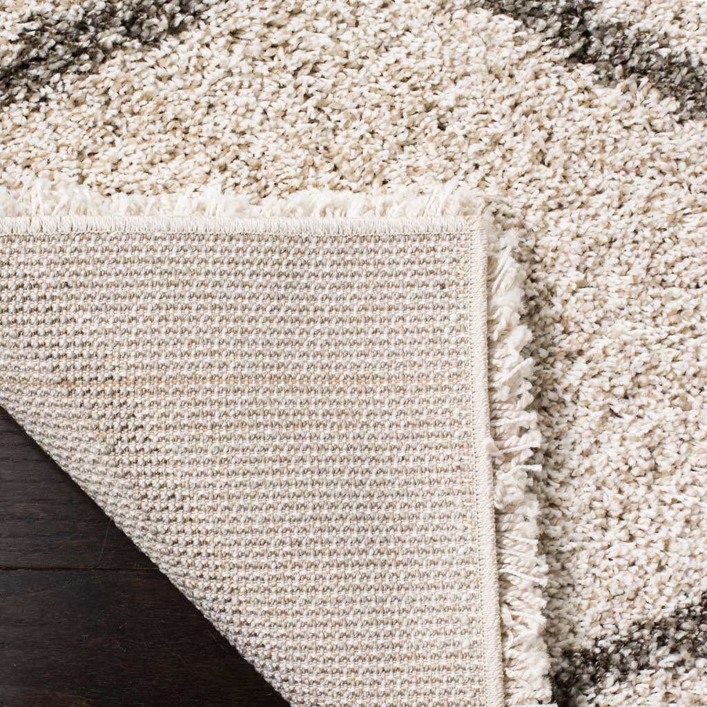 Woven underside and bound edge support the ivory shag