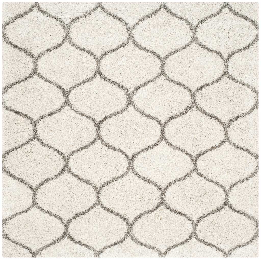 Square ivory rug patterned with soft gray interlocking curves
