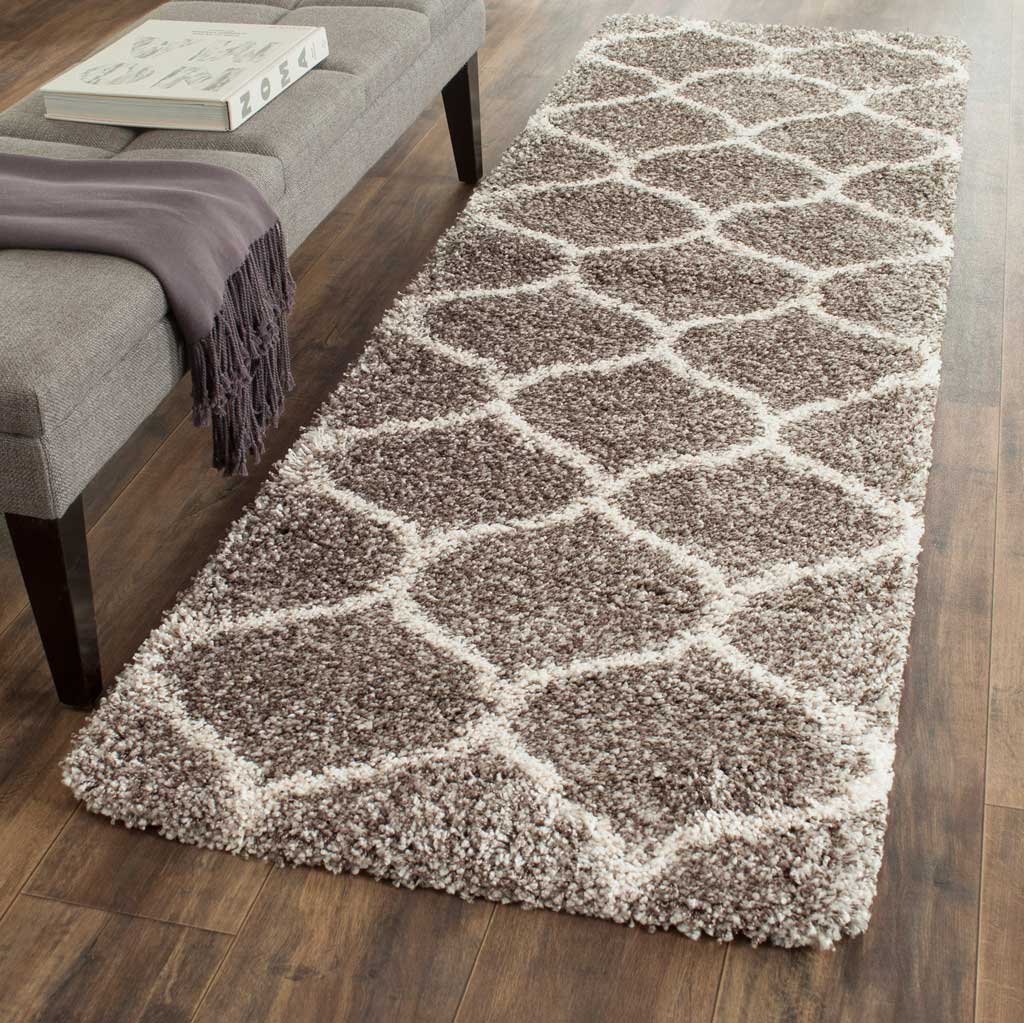 Cozy gray shag and creamy ivory trellis shapes lend soft structure to the floor.