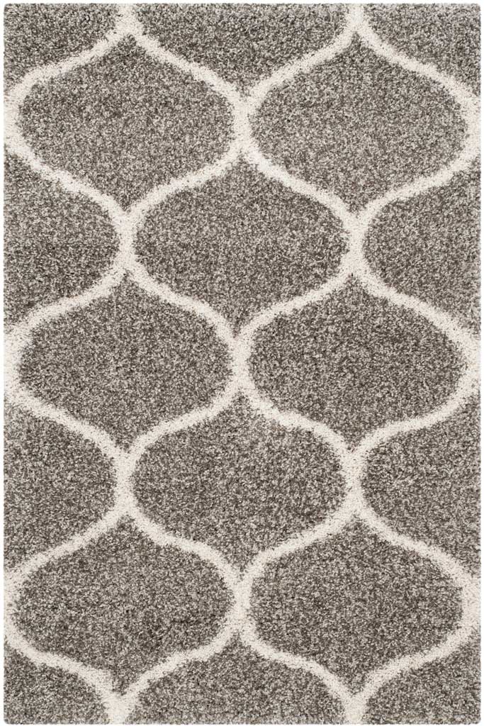 Gray rectangular shag rug with bold ivory interlocking curves