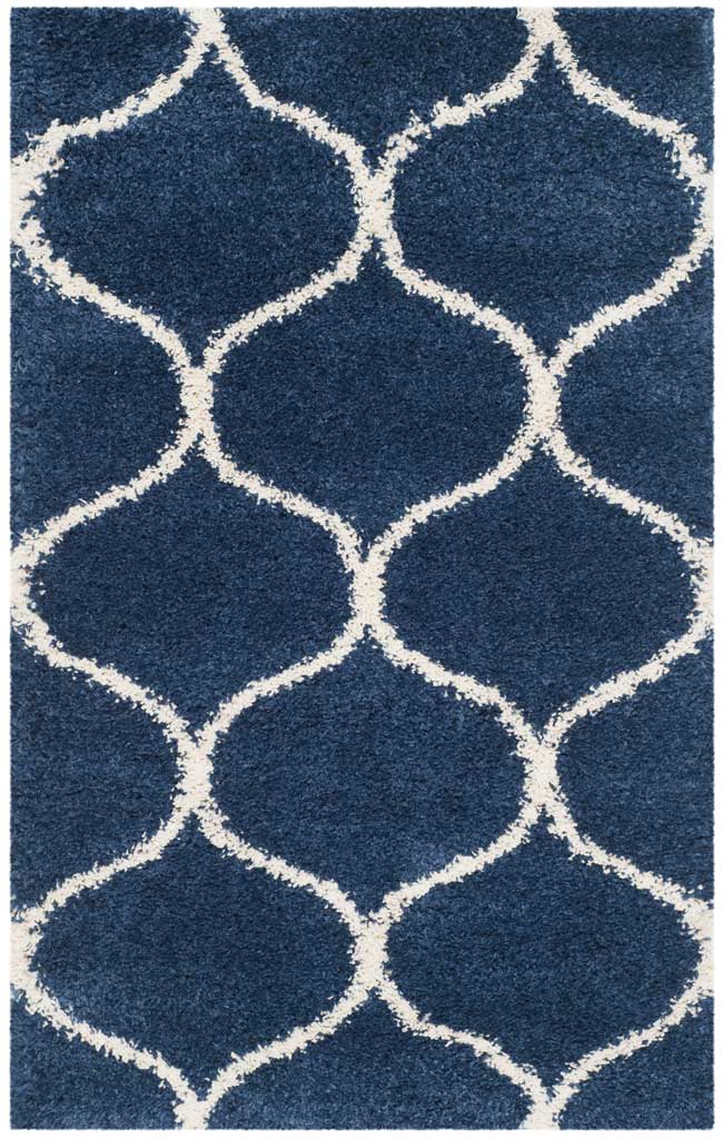 Small navy rug with oversized ivory curved diamonds