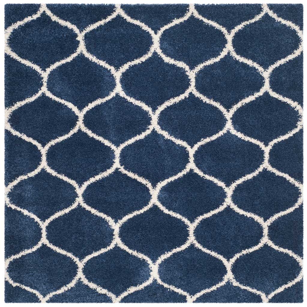 Square navy rug with repeating ivory curved trellis lines