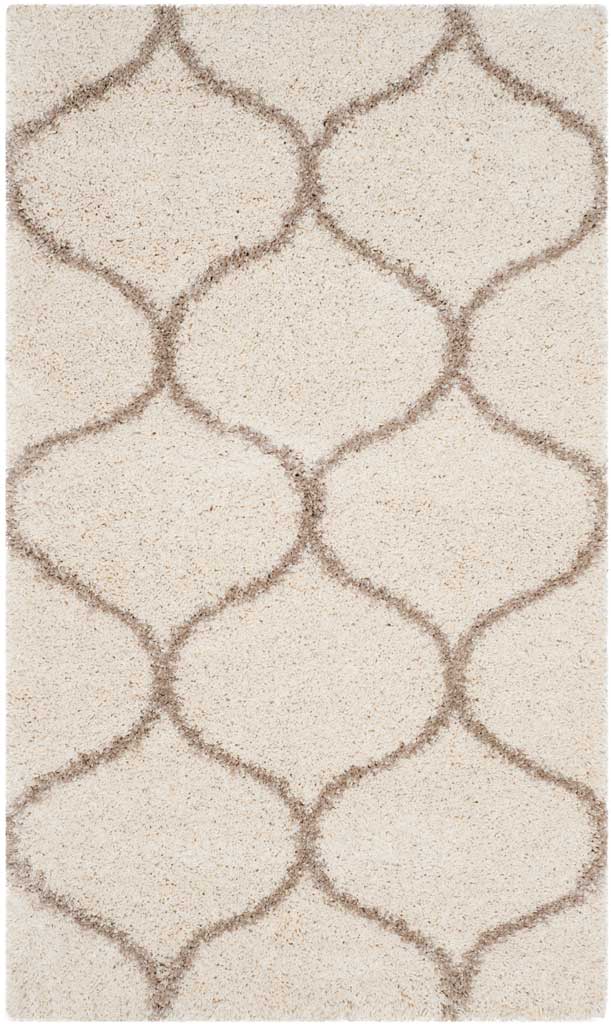 Small ivory shag rug with large beige rounded diamonds