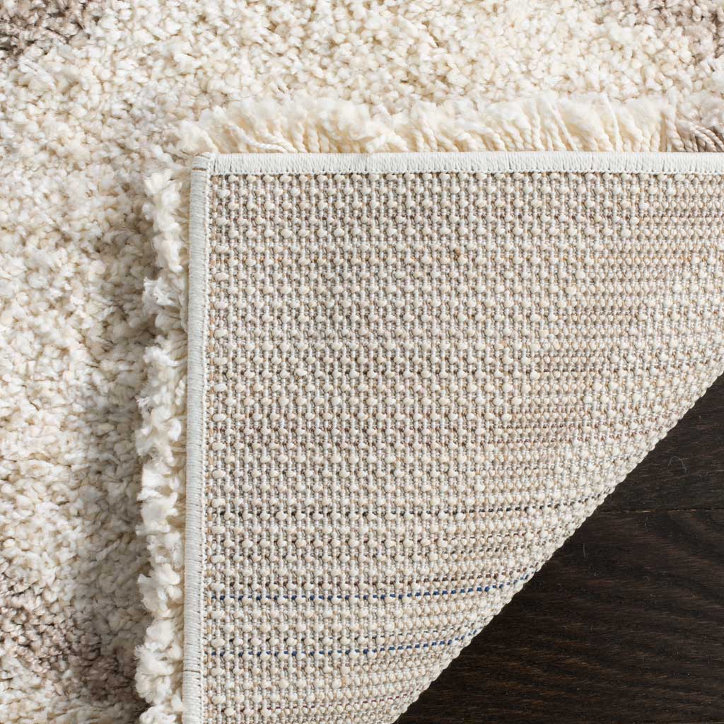 Woven backing and ivory binding support the deep shag pile