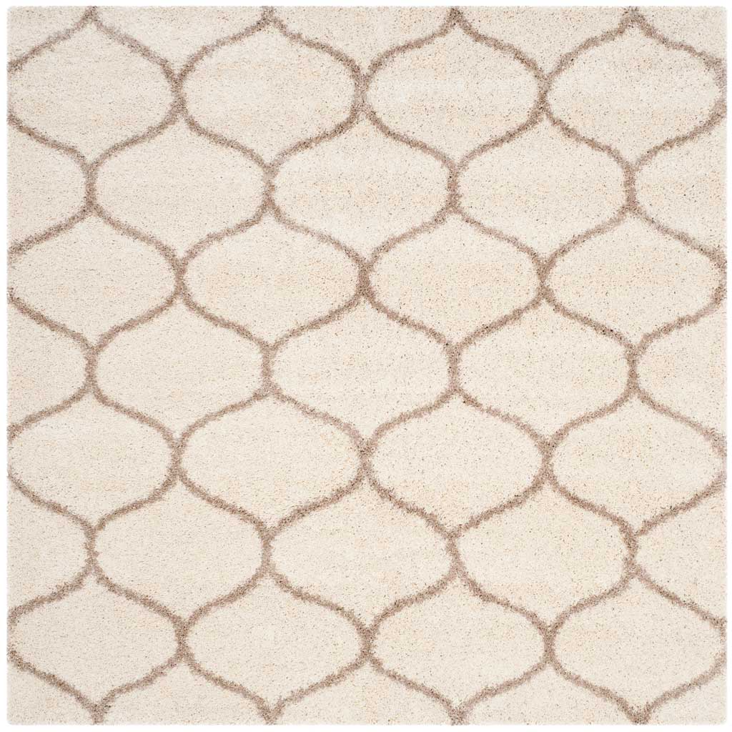 Square ivory rug covered in softly curved beige lattice lines