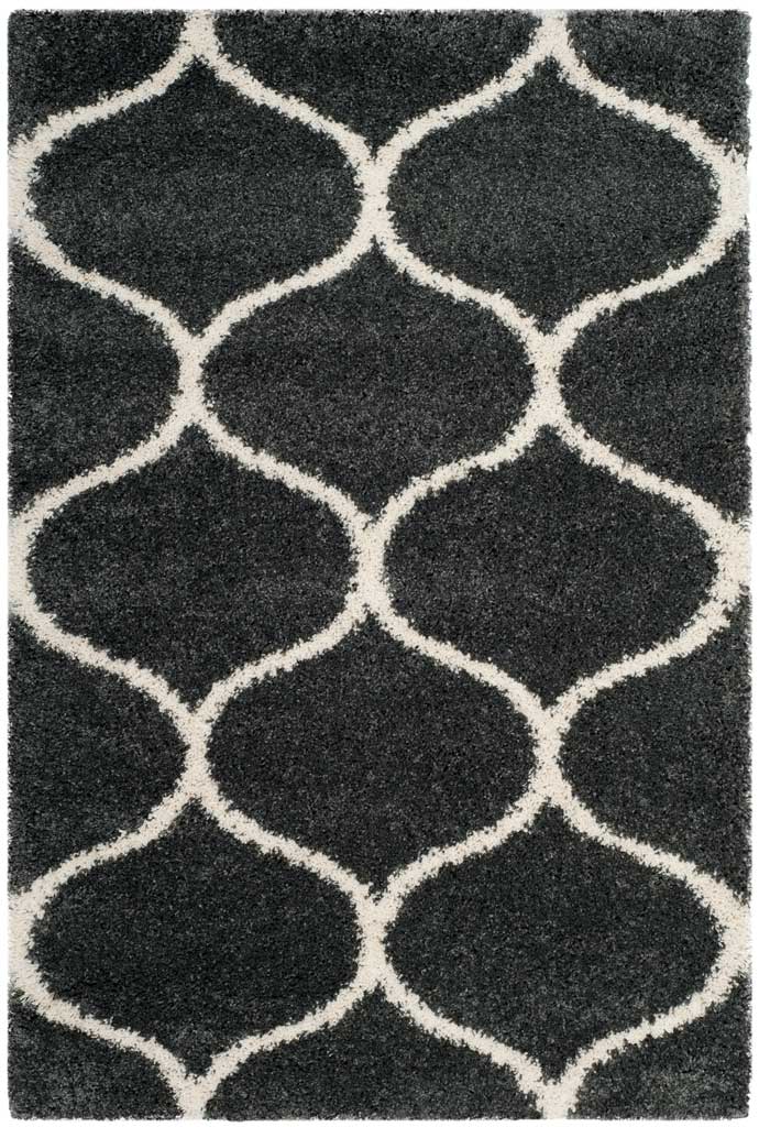 Dark gray rectangular rug with a bold ivory rounded trellis