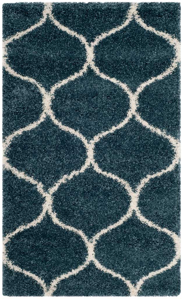Small slate blue rug with generous ivory rounded diamonds