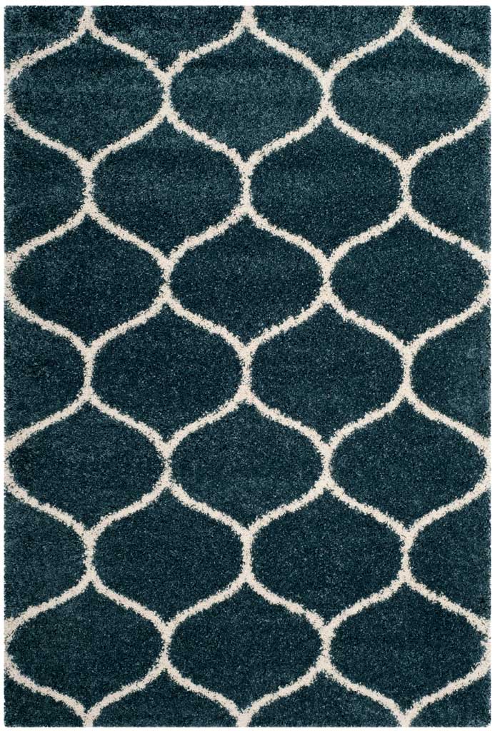 Ivory contours form rounded shapes on plush slate blue pile