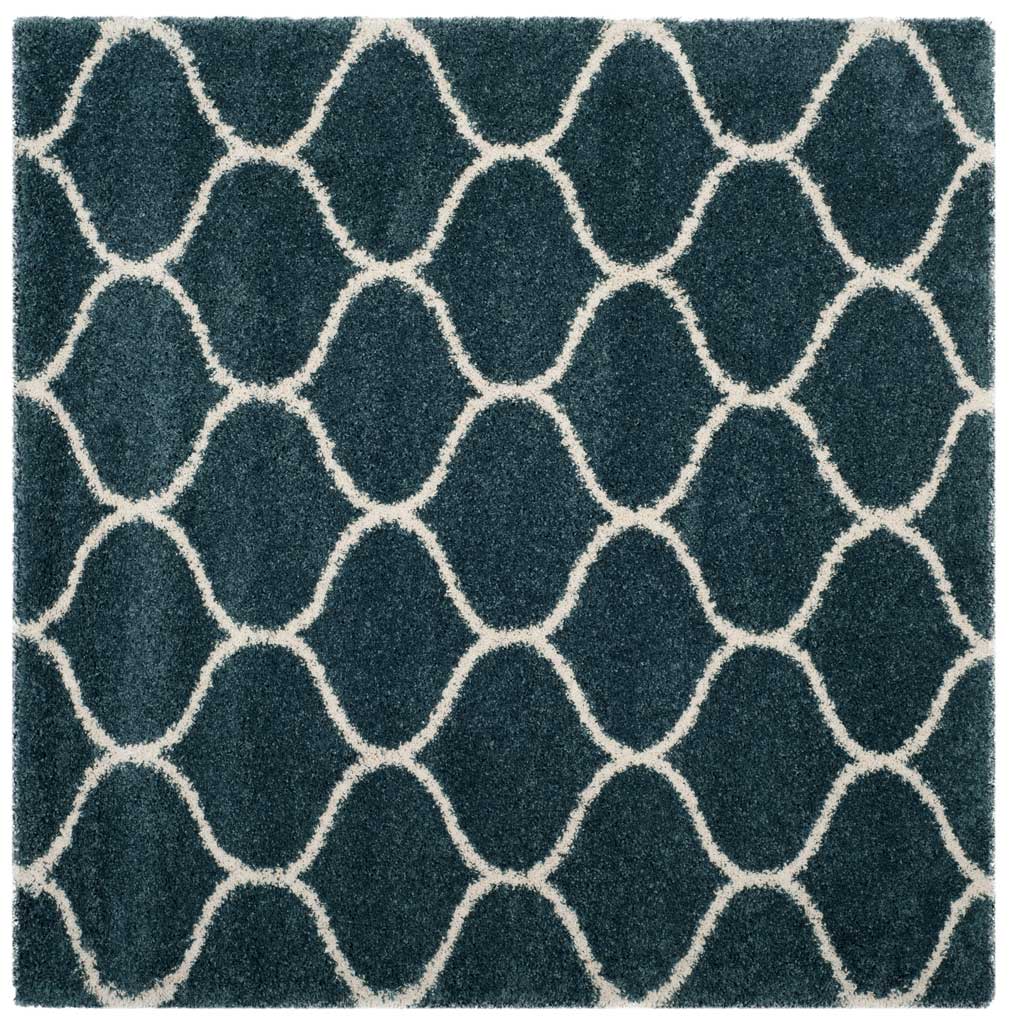 Square slate blue rug filled with interlocking ivory curves