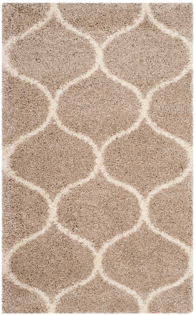Small beige rug with oversized ivory curved diamonds