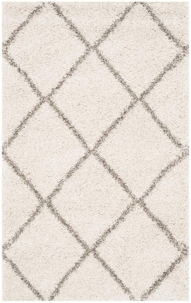 Compact ivory rug with generous gray diamonds and soft shag