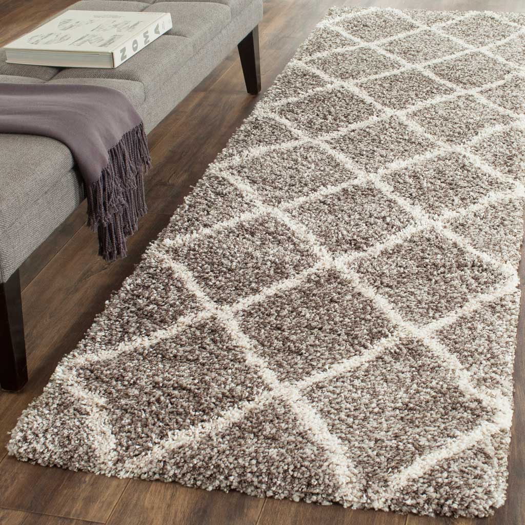 Plush gray and ivory trellis runner adds cozy definition to a living space.