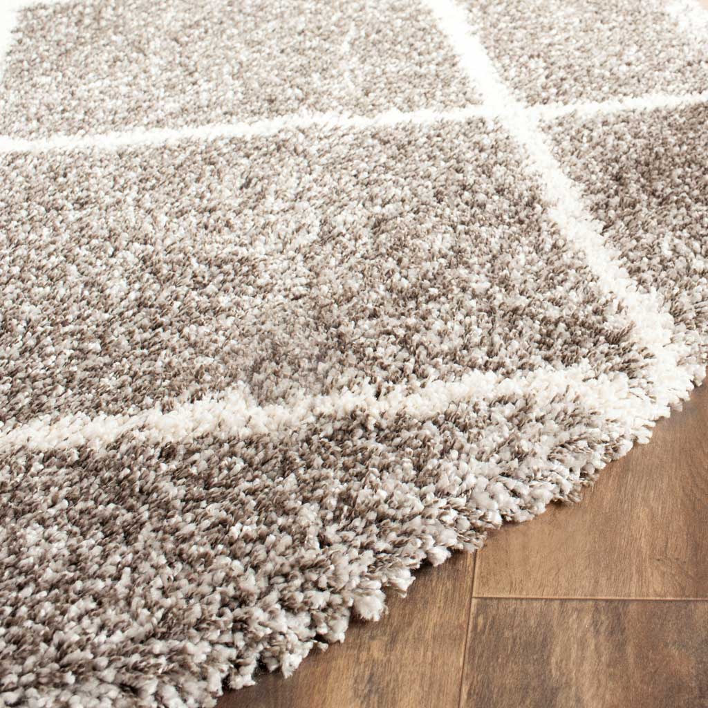 Speckled gray shag and soft ivory lines create rich texture at the rug edge
