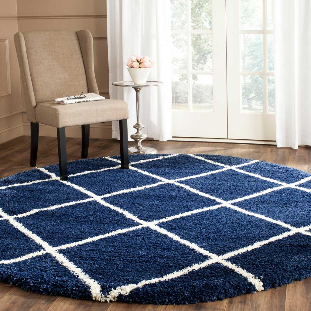 Deep navy shag grounds the space while bright ivory diamonds enliven the design
