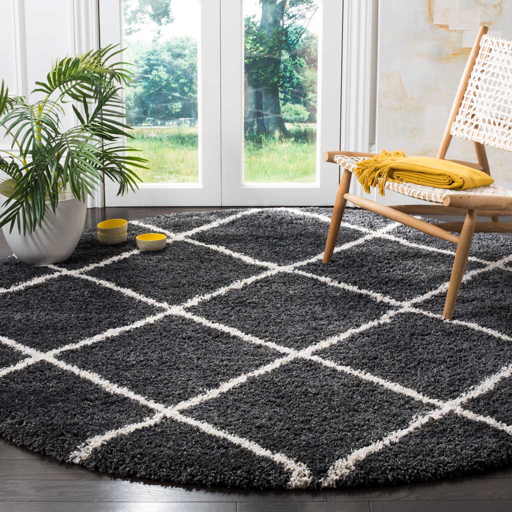 A high-pile charcoal rug adds graphic ivory diamonds and a cozy touch underfoot