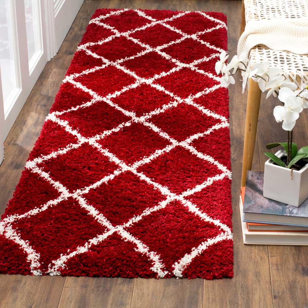 Vibrant red shag and ivory crisscross lines bring warmth and lively pattern underfoot.
