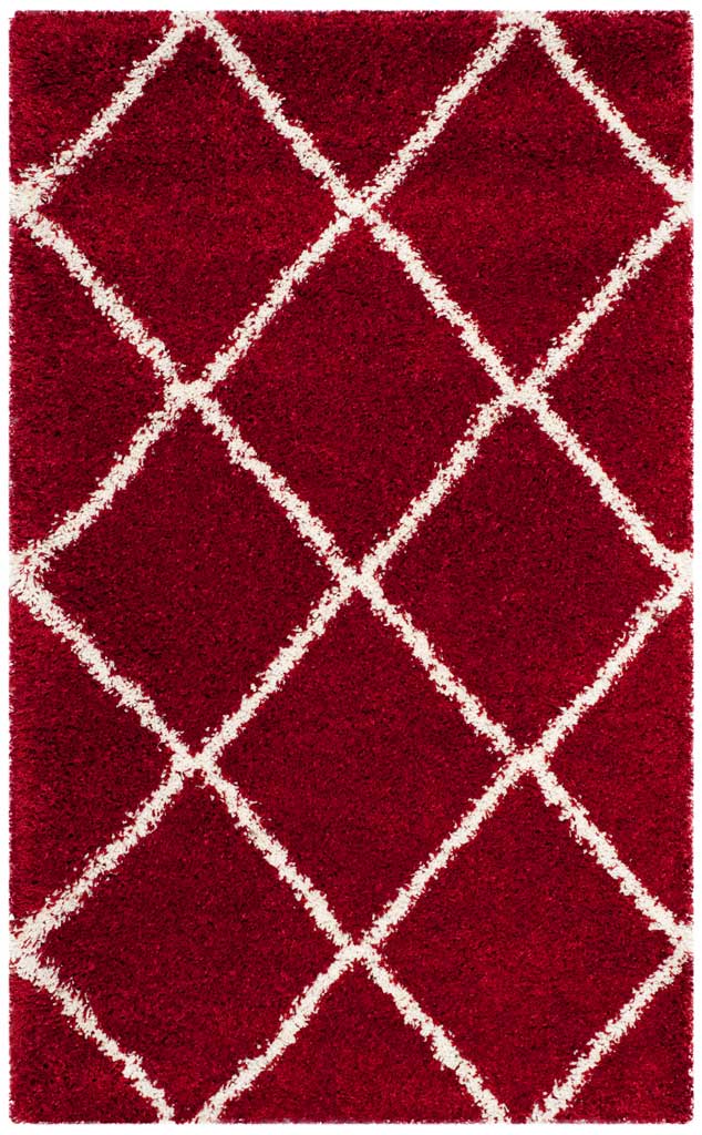 Compact red rug with an ivory diamond grid and deep pile