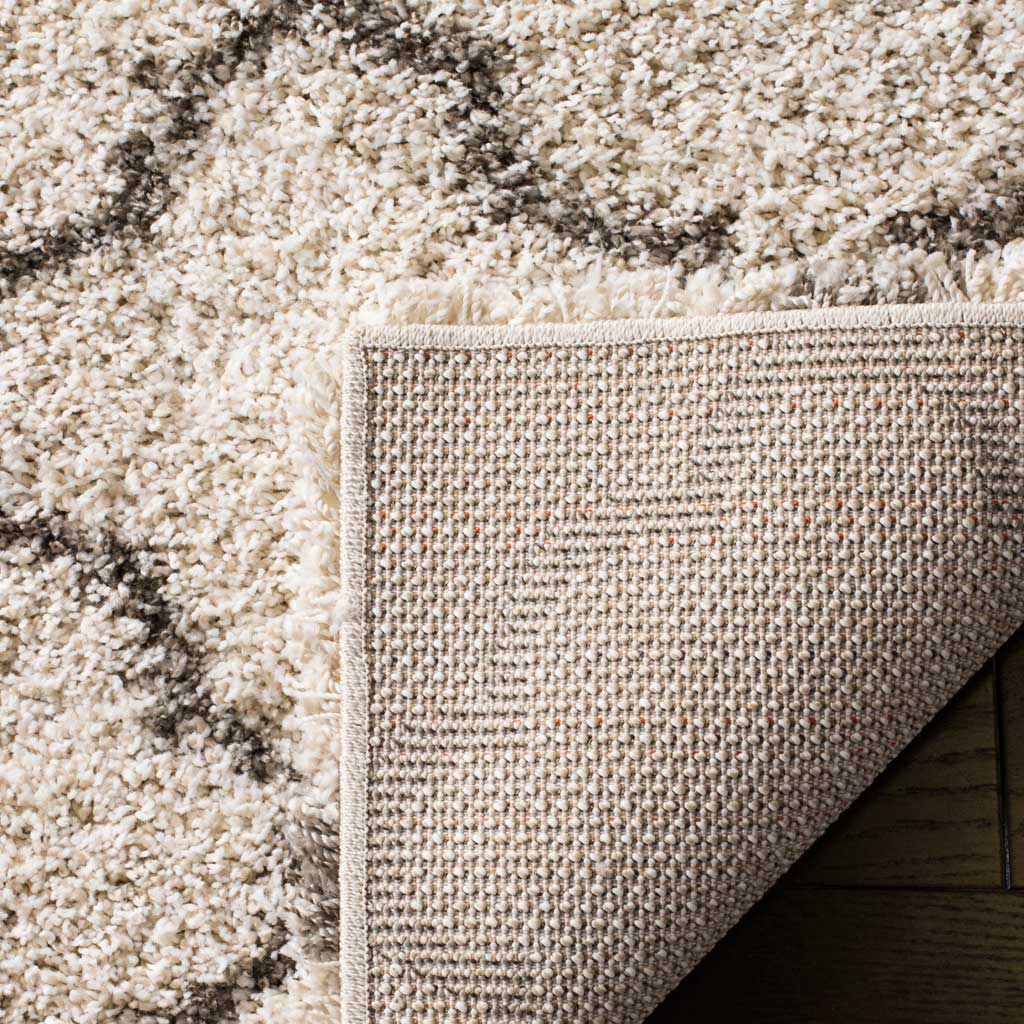 Textured backing sits beneath the ivory and gray shag surface