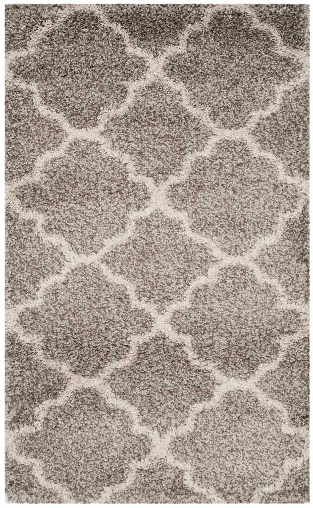 Small gray rug with interlocking ivory quatrefoils and dense shag