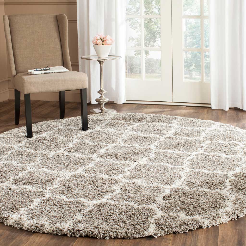 A dense gray pile and small ivory quatrefoils bring welcoming pattern to the floor