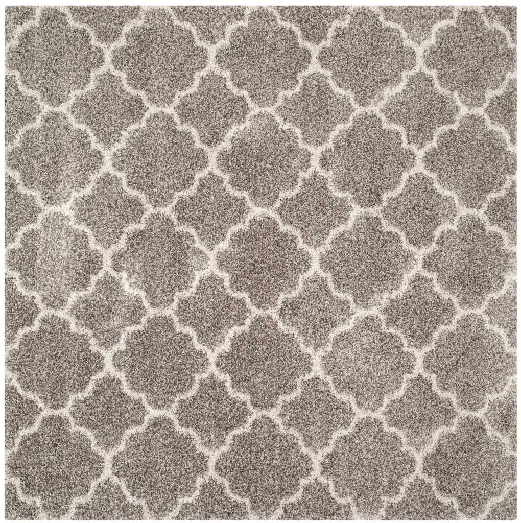 Square gray shag rug covered in a delicate ivory quatrefoil trellis