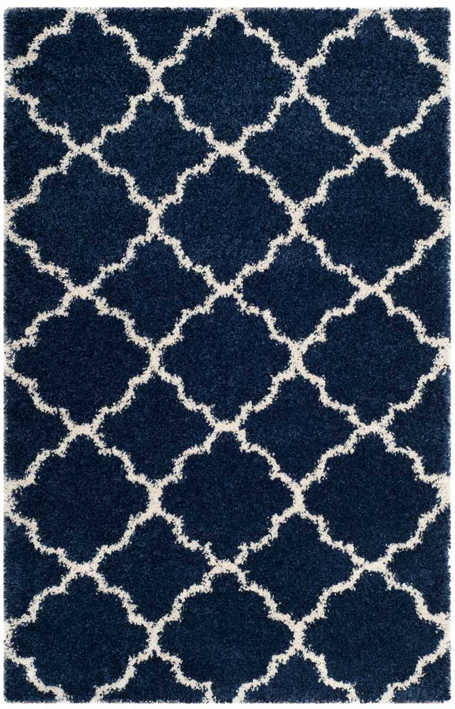 Navy rectangular shag rug with crisp ivory curved motifs