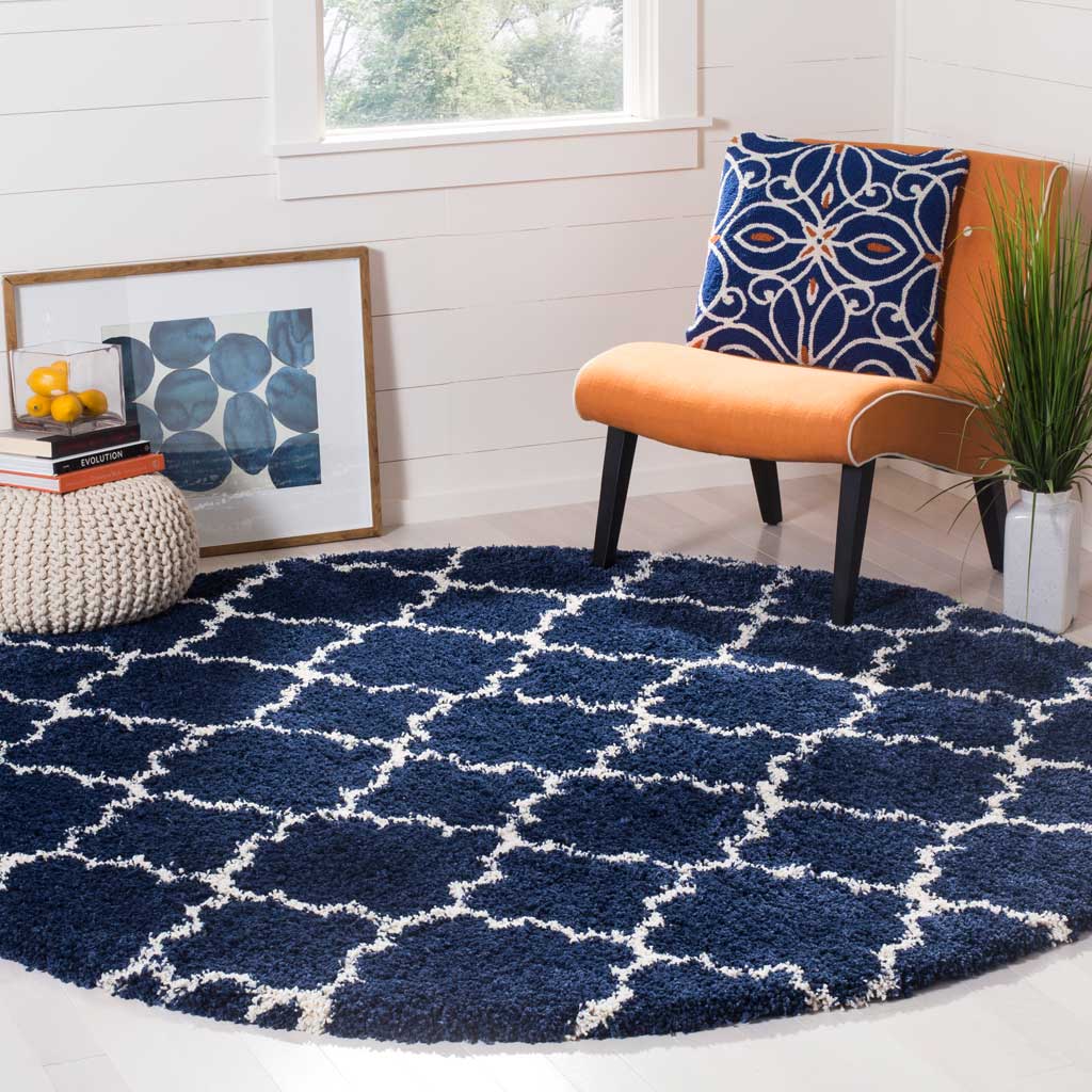A navy pile with small ivory quatrefoils gives this round rug rich color and cozy texture