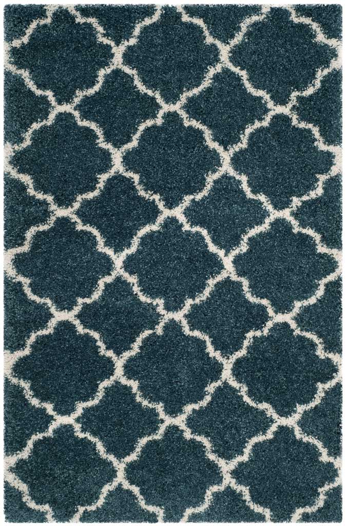 Blue rectangular shag rug with an airy ivory curved trellis