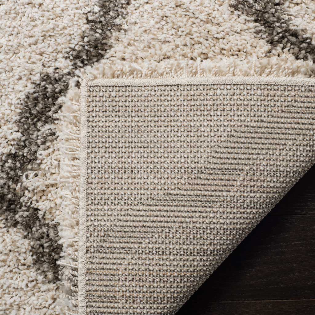Woven underside and ivory binding support the thick pile